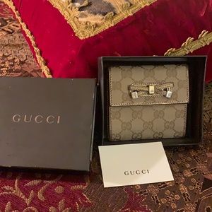 Authentic Gucci GG trifold bow wallet